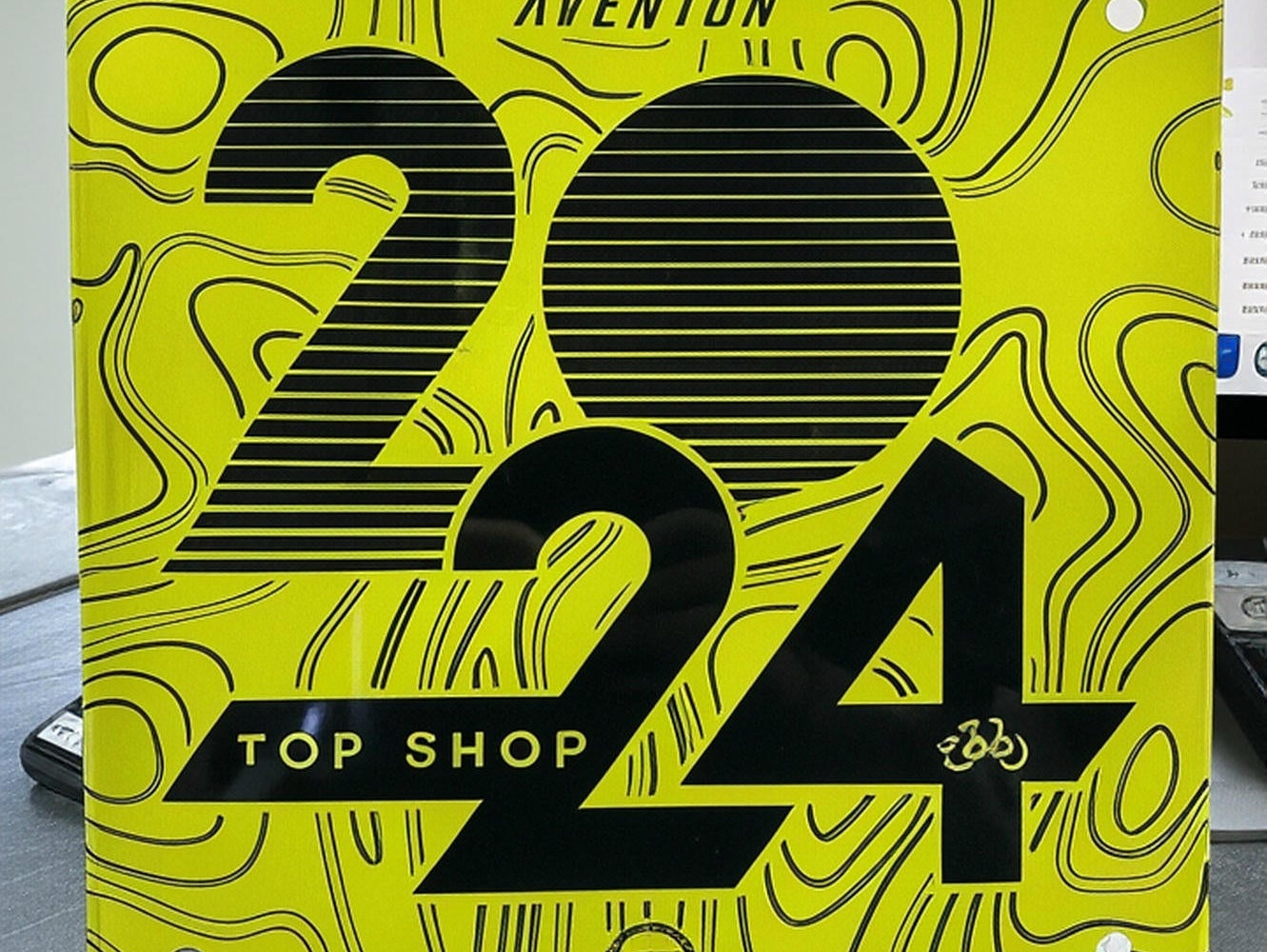 Aventon Top Shop 2024 badge on two adventure electric bikes at CyclErie ebike shop in Erie, CO
