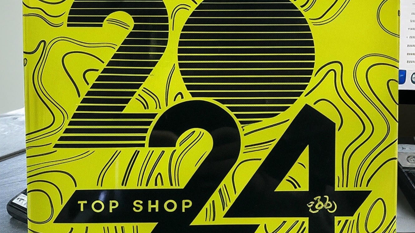 Aventon Top Shop 2024 badge on two adventure electric bikes at CyclErie ebike shop in Erie, CO