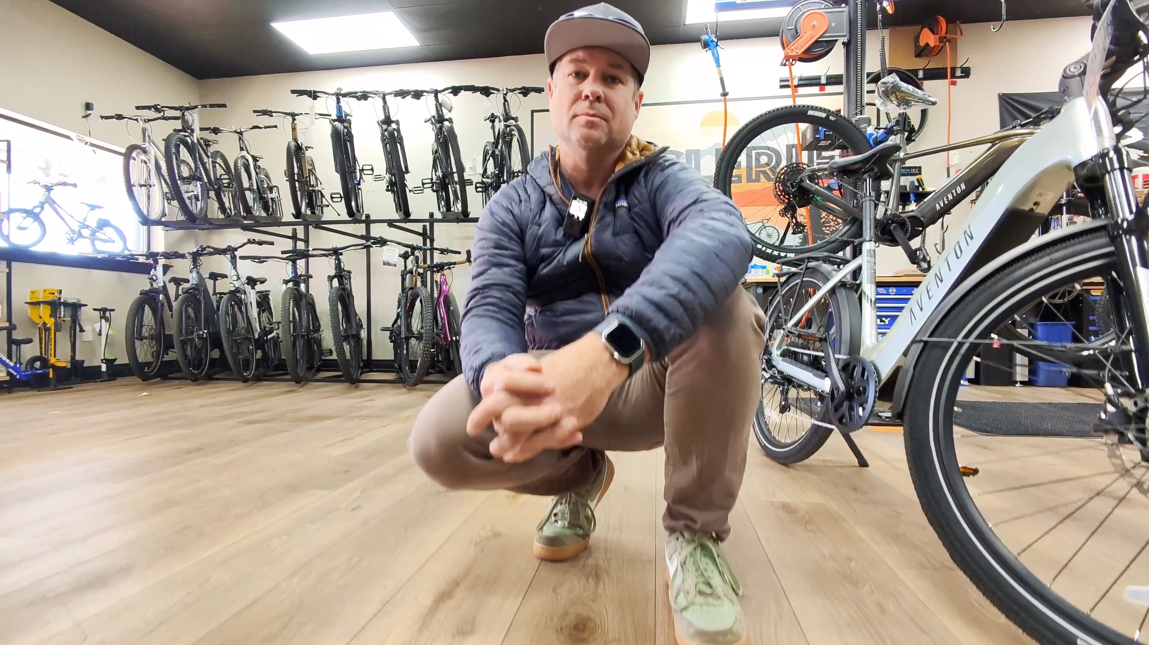 DJ Kneeling at CyclErie with the Aventon Level.3 Commuter in Glacier Mint