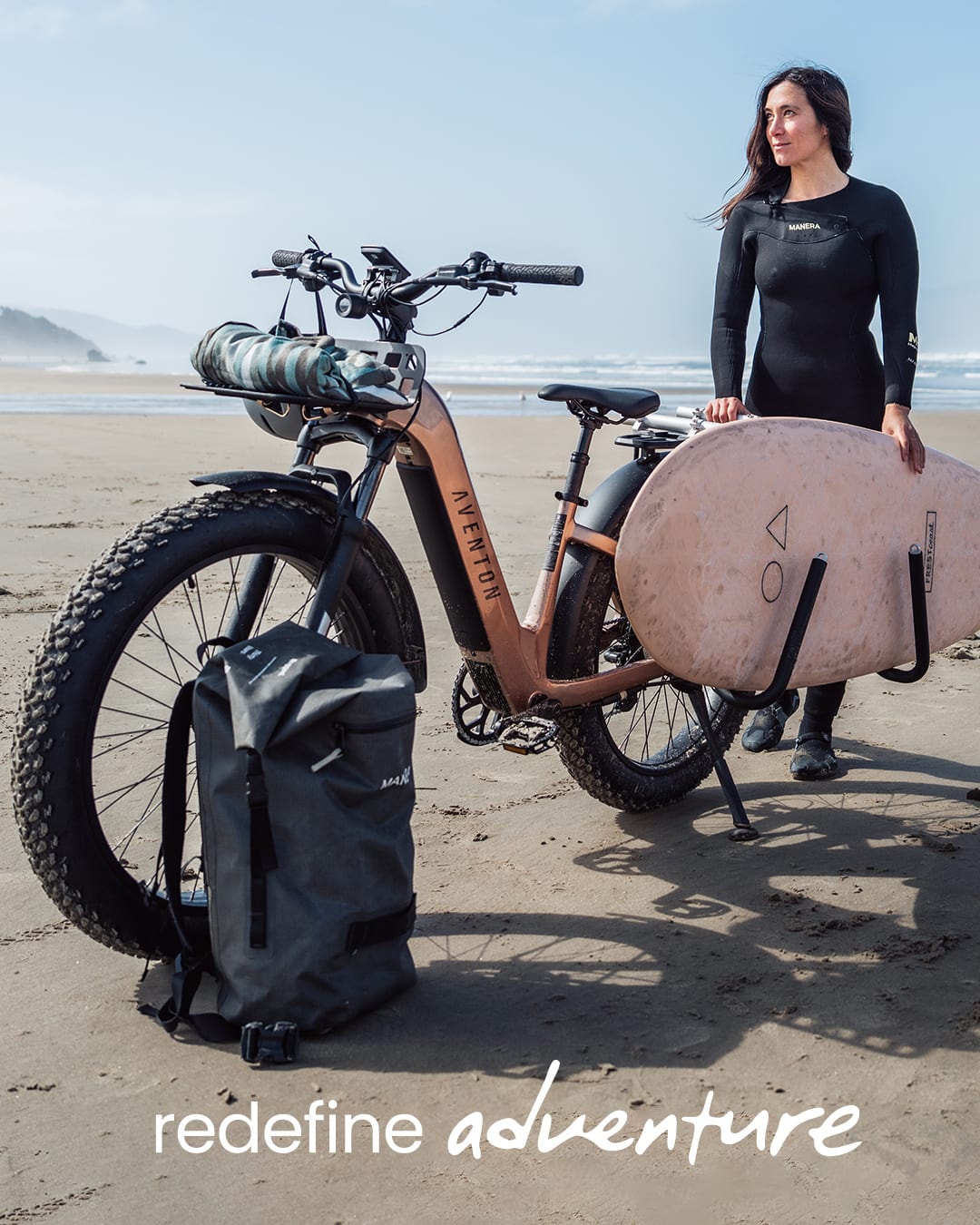Aventon Aventure 3 riding on the sand at the beach with a front rack, available at CyclErie’s ebike shop in Erie, CO.
