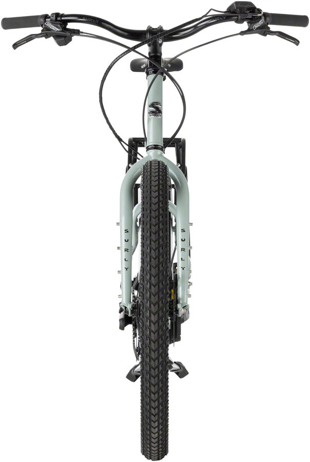 Surly Skid Loader electric bike with 27.5" tires, hauling gear on trail.