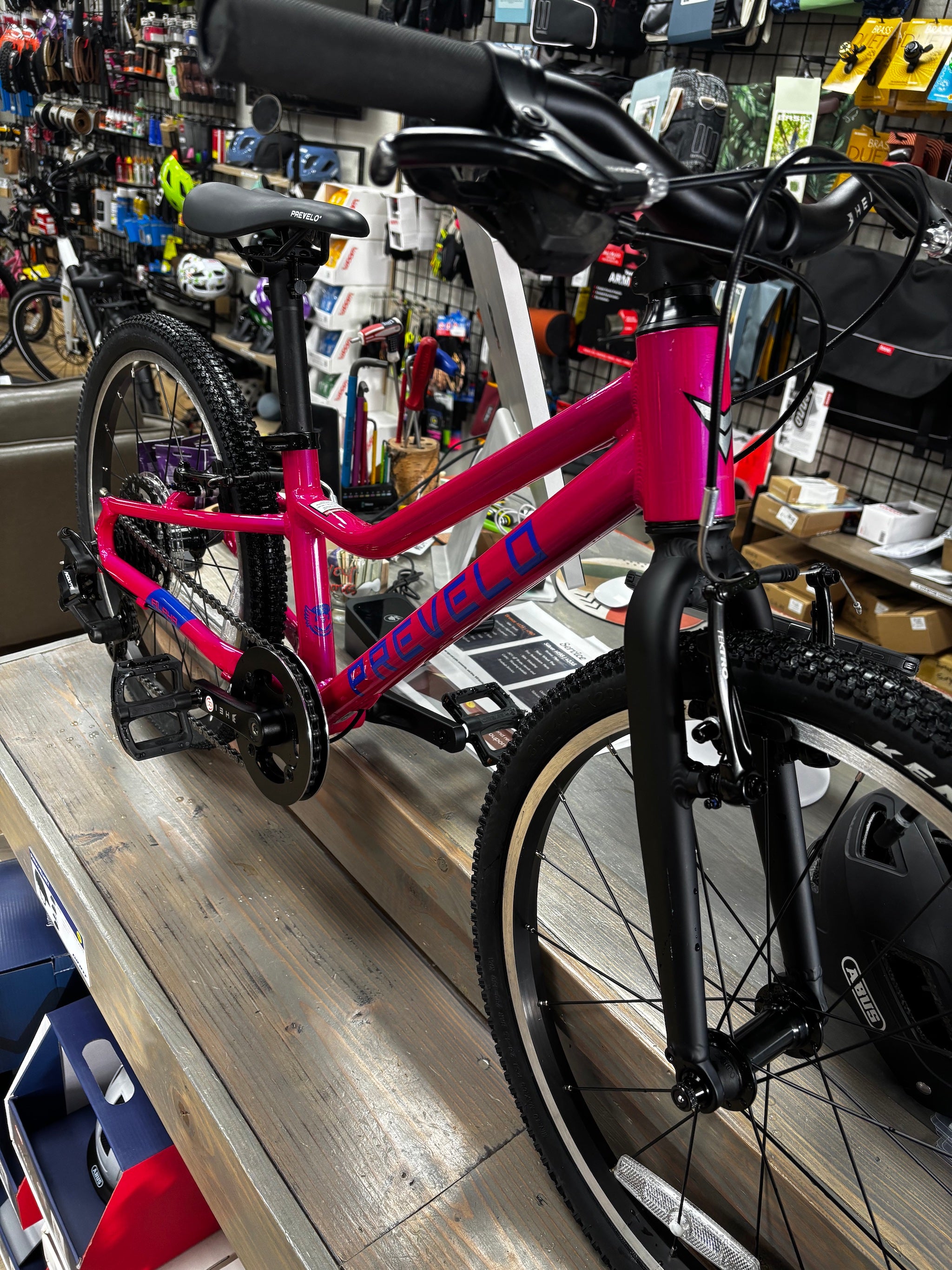 Pre-loved Prevelo Alpha 3 20-inch kids bike in Party Pink from CyclErie, excellent used condition, perfect for Erie Community Park pump track and Valmont Bike Park trails.