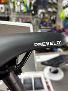 Pre-loved Prevelo Alpha 3 20-inch kids bike in Party Pink from CyclErie, excellent used condition, perfect for Erie Community Park pump track and Valmont Bike Park trails.