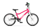 The Woom Go 3 is a pink and white lightweight kids’ bike for ages 4+, shown with training wheels and a kickstand. The “woom” logo appears on the frame, all set against a plain white background. Available at CyclErie.