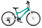 A teal and white Woom Go 4 kids’ bike with 20-inch wheels, black seat, and silver pedals is shown side view on white. The ultralight aluminum frame, branded Woom, is available for ages 6+ at CyclErie.