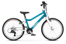 The Woom Go 4 is a blue and white ultralight aluminum kids’ bike for ages 6+ at CyclErie, with a slanted top tube, black saddle and handlebars, white wheels with red accents, and the Woom brand name on the frame.