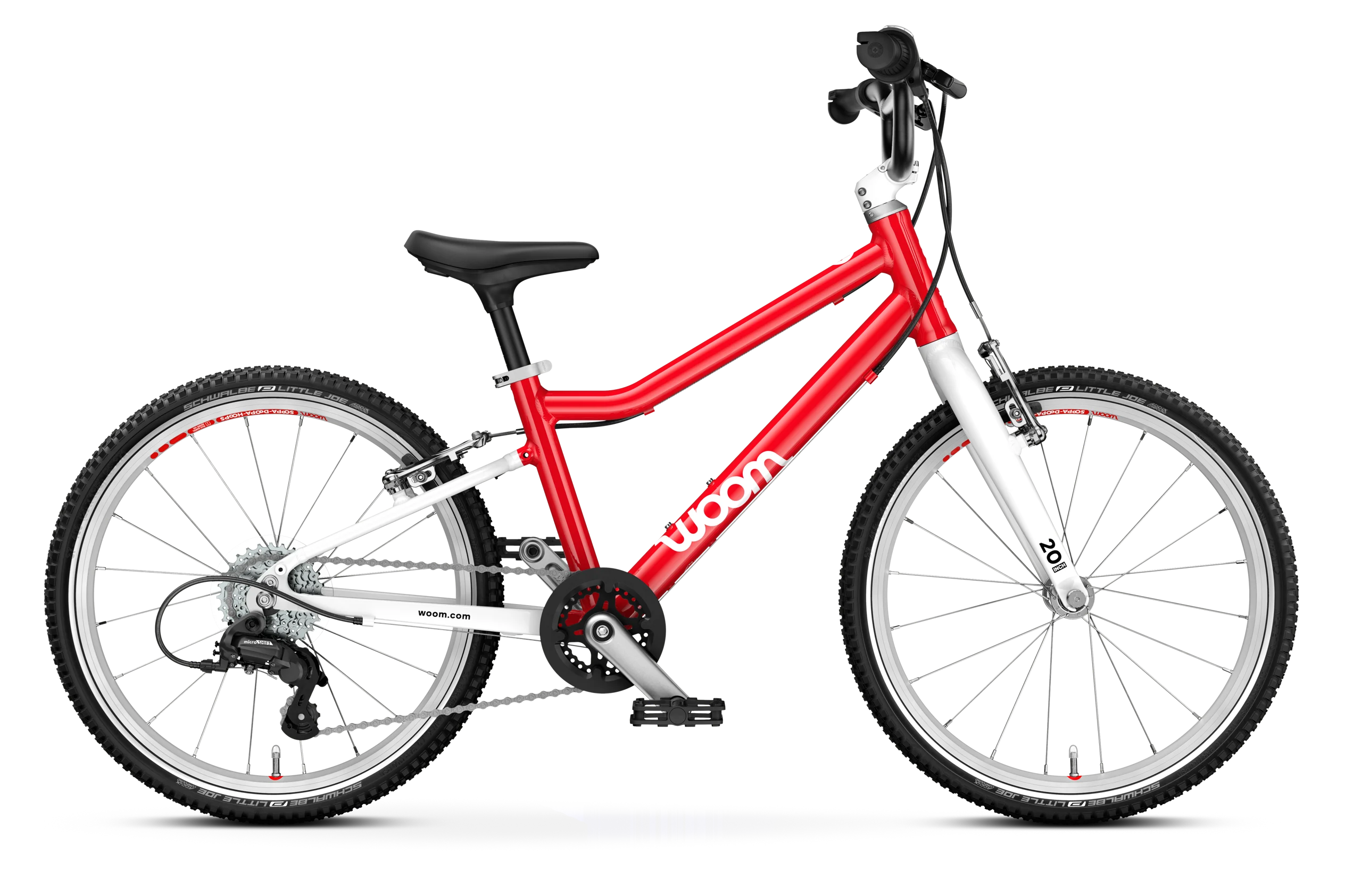 The Woom Go 4 is a red and white lightweight kids’ bike for ages 6+ with an ultralight aluminum frame, black seat, and knobby tires. Shown from the side on a white background, the Woom brand name appears on the frame. Available at CyclErie.