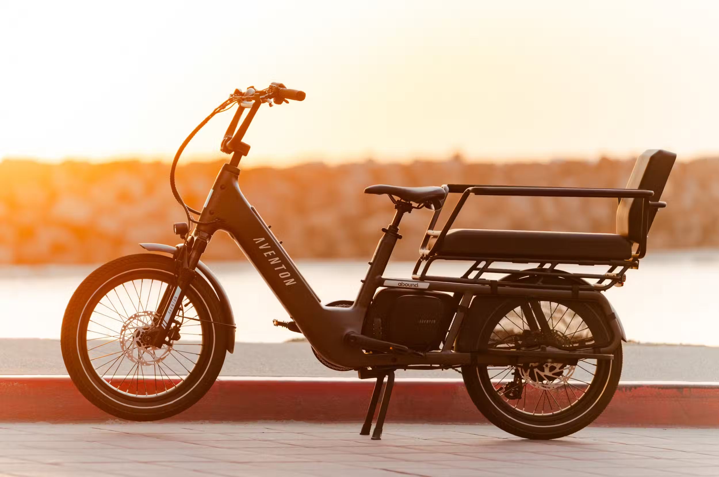 Aventon Abound LR cargo e-bike in stealth black with child carrier kit available at CyclErie in Erie, CO.