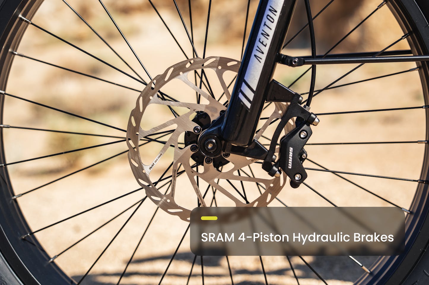 Close-up of a Aventon Aventure M MID-drive ebike wheel with SRAM 4-Piston Hydraulic Brakes available at CyclErie in Erie, CO. 