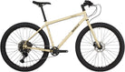 Full view of a Whipped Butter Surly Bridge Club gravel bike with 27.5 wheels at CyclErie bike shop in Erie, CO, showcasing a custom bicycle for Boulder County trails.