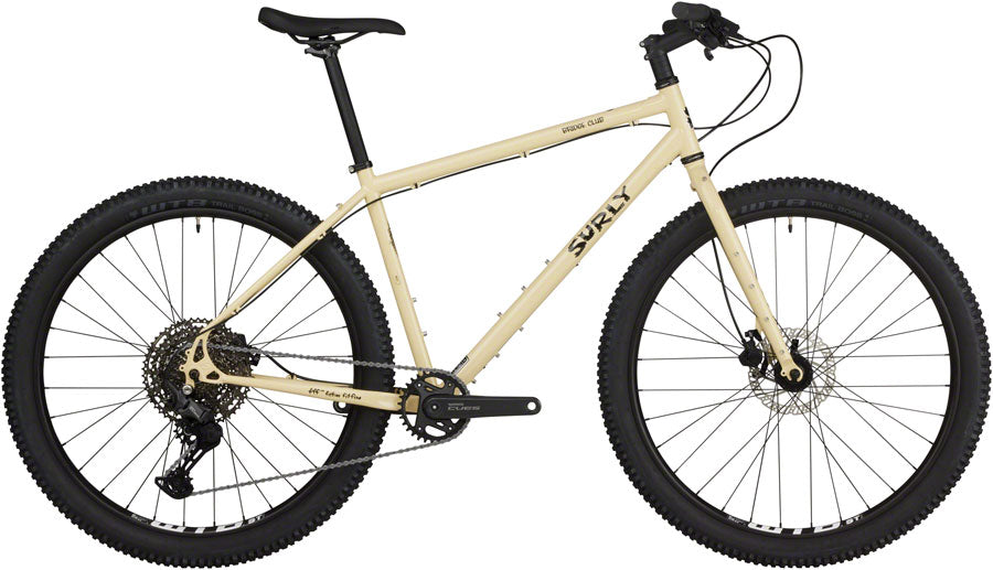 Full view of a Whipped Butter Surly Bridge Club gravel bike with 27.5 wheels at CyclErie bike shop in Erie, CO, showcasing a custom bicycle for Boulder County trails.