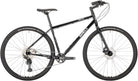 Full view of a black Surly Bridge Club gravel bike at CyclErie bike shop in Erie, CO, showcasing a custom bicycle for Boulder County trails.