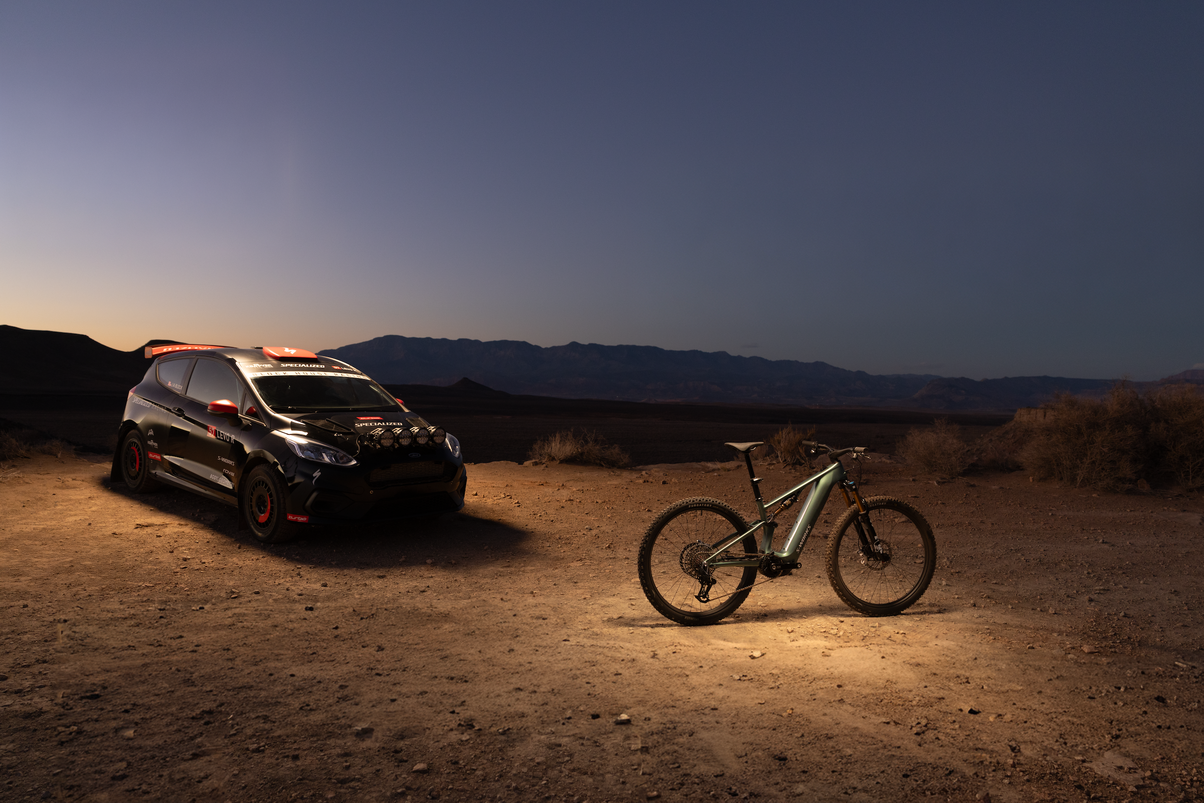 Premium Specialized Turbo Levo R S-Works full-suspension eMTB on scenic singletrack trails in Erie, Colorado. This flagship electric mountain bike features a high-performance motor with unlockable Class 3 assist, reaching a top speed of 28 mph available at CyclErie.