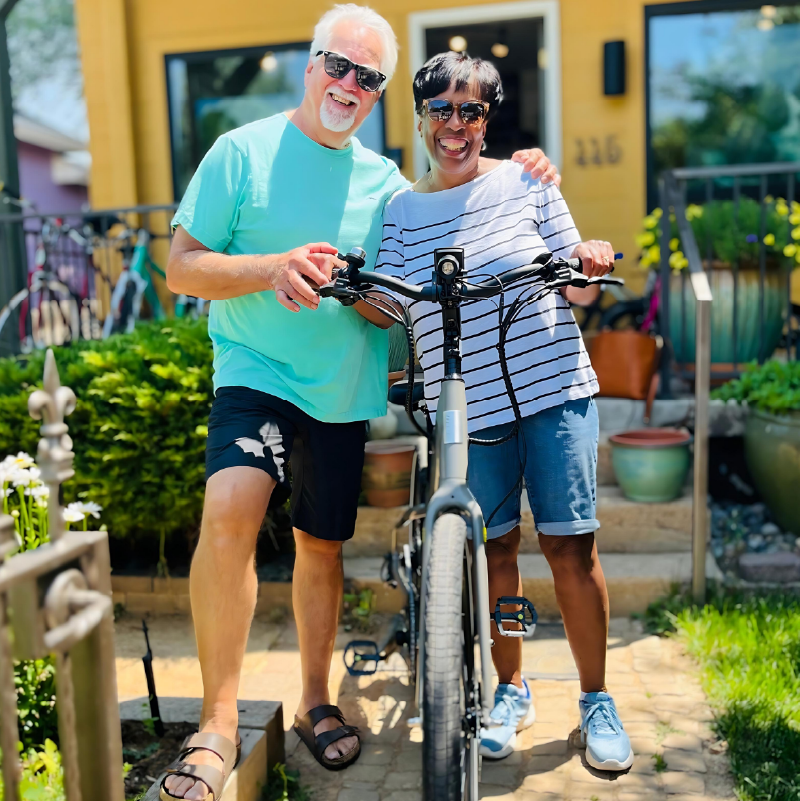 Middle Aged Couple Smiling while standing with their new eBIke