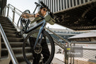 Carrying the 37 lb Aventon Soltera 3 ADV ebike up stairs, available at CyclErie in Erie, CO.
